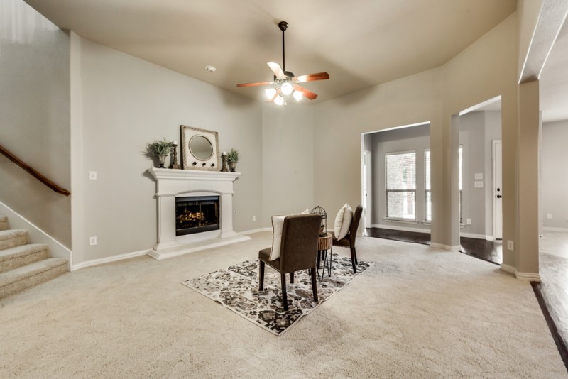    Inviting Family Room with Tall Ceilings and Cast Stone Fireplace 