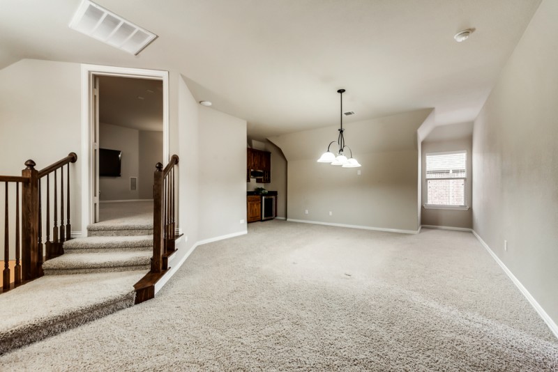    Game Room with Wet Bar with Granite Countertop Wine Fridge and Built In Microwave 