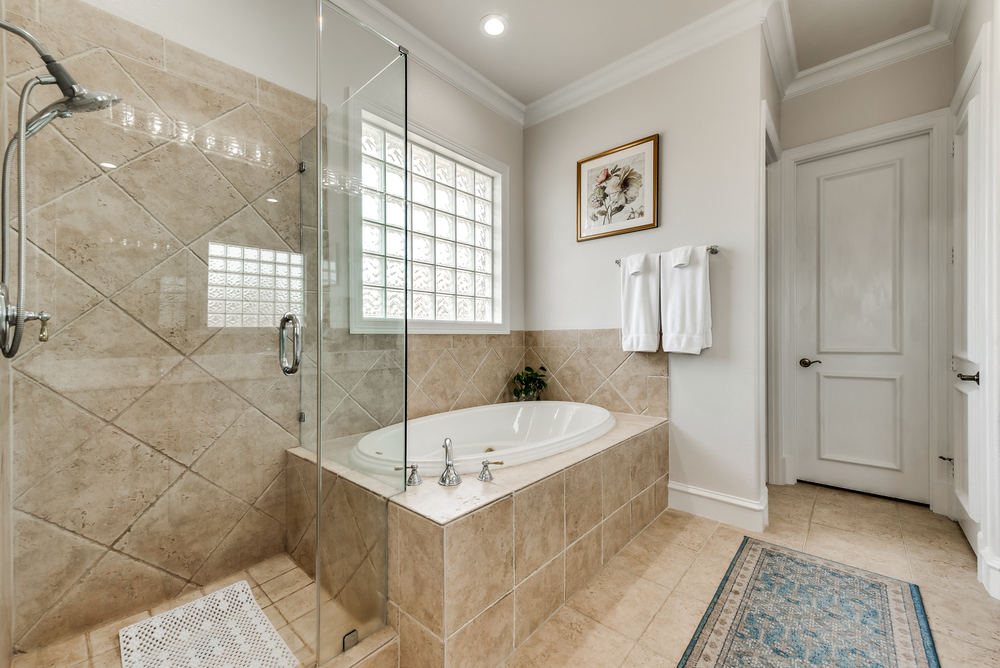    Spa Like Master Bath offers Oversized Jetted Tub and Seamless Glass Shower 