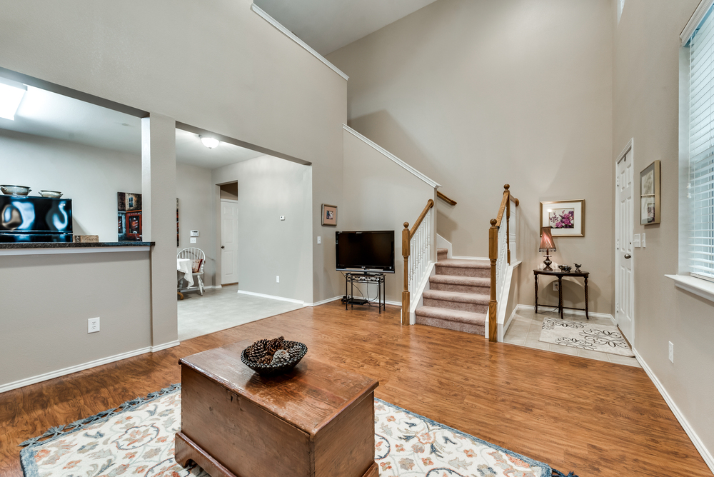   Inviting Family Room with Hardwood Floors and Soaring Ceilings 