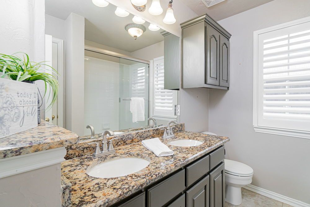    Full Bathroom with Dual Sinks 