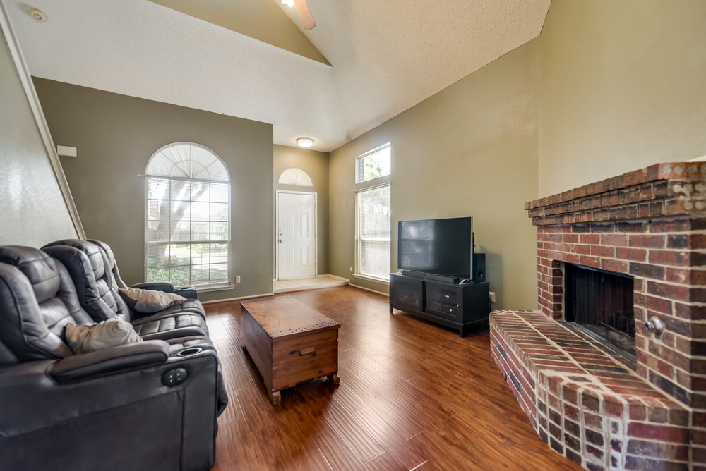    Inviting Family Room with Brick Fireplace 