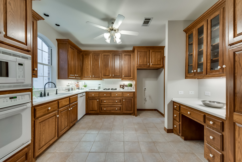    Eat In Kitchen offers Tile Backsplash and Abundance of Built In Cabinetry 