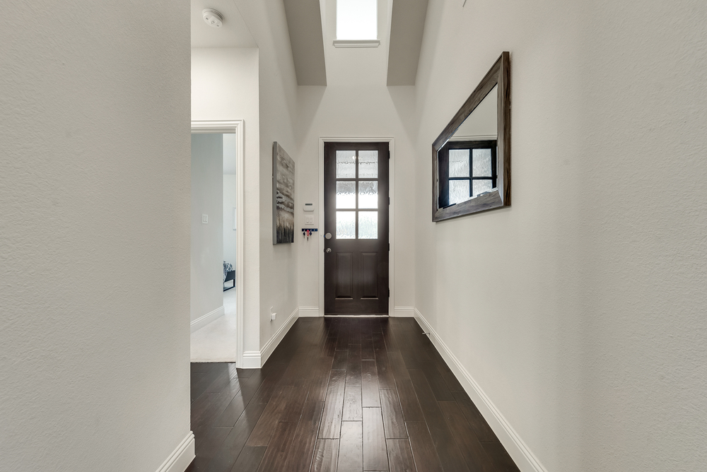    Entry with Beautiful Glass Inlaid Front Door 